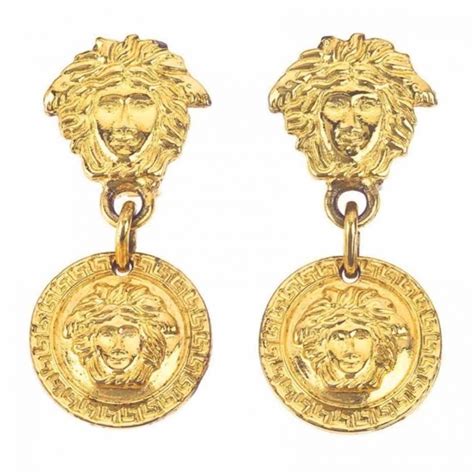 boucle d'oreille en or versace ovale ondulée|Boucles d’oreilles Versace pour femme .